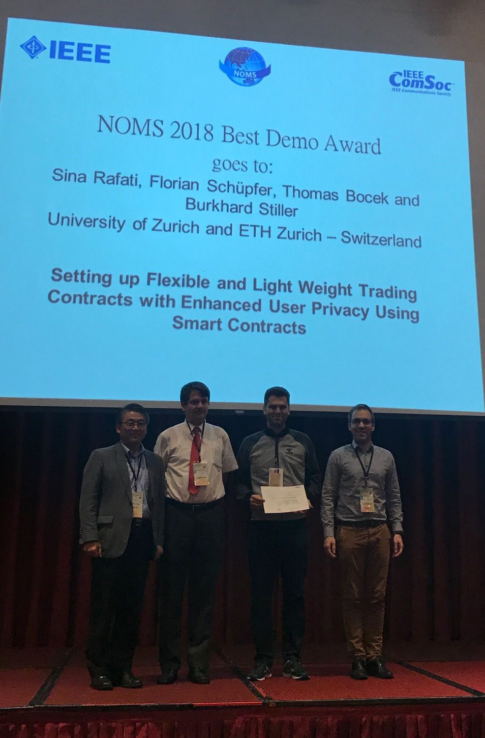 16th IFIP/IEEE NOMS 2018 Best Demo Award Team at NOMS with the Plaque Received: from the left, Prof. Dr. James Hong, Prof. Dr. Burkhard Stiller, Sina Rafati, Prof. Dr. Remi Badonnel (picture thanks to Dr. Marinos Charalambides) 